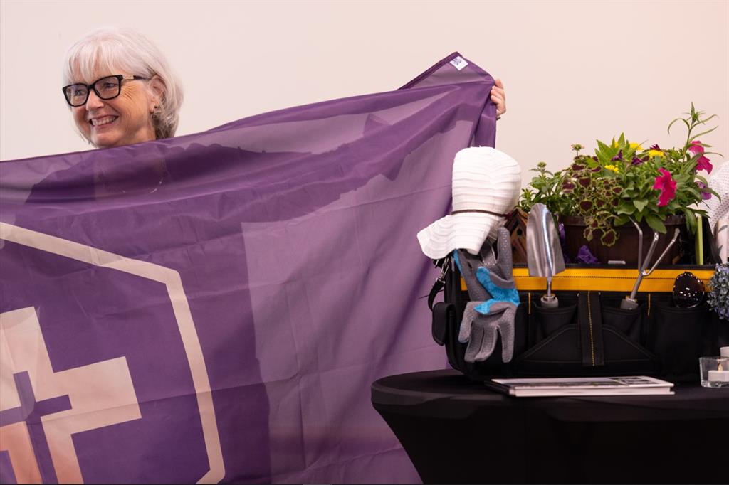 Jan Kaffer holding an HDGH flag